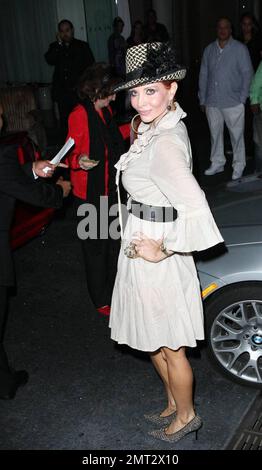 Phoebe Price wears a simple tan dress with a black belt and fedora as she attends a party at the Mondrian Hotel in Los Angeles, CA. 8/11/09. Stock Photo