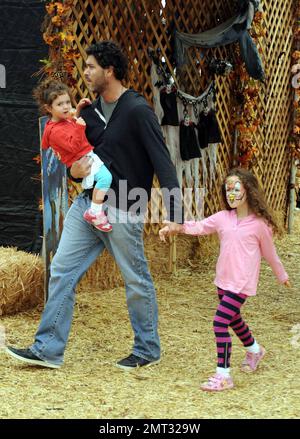 Soleil Moon Frye shops for ther perfect pumpkin with her husband Jason Goldberg and their two daughters, Poet and Jagger at Mr Bones Pumpkin Patch in West Hollywood, CA. 10/16/10 Stock Photo