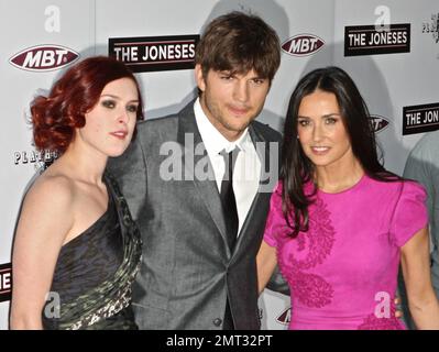 Demi Moore and husband Ashton Kutcher arrive to the premiere of 'The Joneses' at ArcLight Cinemas with Demi's oldest daughter Rumer Willis.  Demi, who has recently expressed her anger towards the media for claiming she spends thousands of dollars on cosmetic surgery, showed off her young side in a flashy pink mini dress with ruffle detail.  Los Angeles, CA. 04/08/10.   . Stock Photo