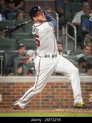 Washington Nationals' Bryce Harper crosses home plate after hitting a solo  home run as Atlanta Braves catcher Tyler Flowers watches in the fourth  inning at Nationals Park in Washington, D.C. on August