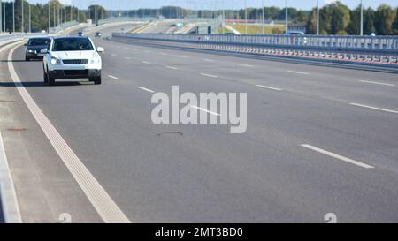 View on a concrete highway. Modern highway safety markings on concrete. Stock Photo