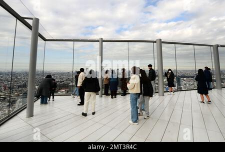 Tourist enjoying the views from the Shibuya Sky roof on top of the Scramble Square building in Shibuya, Tokyo, Japan. Stock Photo