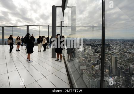 Tourist enjoying the views from the Shibuya Sky roof on top of the Scramble Square building in Shibuya, Tokyo, Japan. Stock Photo