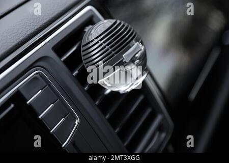 Stylish air freshener clip attached to car ventilation Stock Photo - Alamy