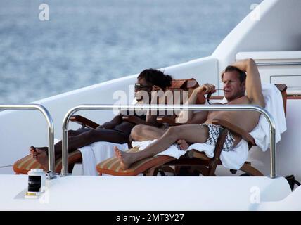 Naomi Campbell and her Russian boyfriend Vladislav Doronin live the life of luxury cruising the water around Miami on a $10,950,000 Lazzara yacht. The couple passed the huge mansion they have reportedly purchased on Star Island for $16,000,000 as they went. The Supermodel lounged in a chair on the top of the double decker Angela D during the sunset ride home with her hunky beau. Miami, FL. 10/11/09. Stock Photo