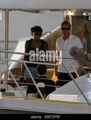 EXCLUSIVE!! Naomi Campbell and her Russian boyfriend Vladislav Doronin live the life of luxury cruising the water around Miami on a $10,950,000 Lazzara yacht. The couple passed the huge mansion they have reportedly purchased on Star Island for $16,000,000 as they went. The Supermodel lounged in a chair on the top of the double decker Angela D during the sunset ride home with her hunky beau but stood up to view their new home as they floated by. Miami, FL. 10/11/09. Stock Photo