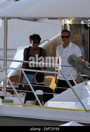 EXCLUSIVE!! Naomi Campbell and her Russian boyfriend Vladislav Doronin live the life of luxury cruising the water around Miami on a $10,950,000 Lazzara yacht. The couple passed the huge mansion they have reportedly purchased on Star Island for $16,000,000 as they went. The Supermodel lounged in a chair on the top of the double decker Angela D during the sunset ride home with her hunky beau but stood up to view their new home as they floated by. Miami, FL. 10/11/09. Stock Photo