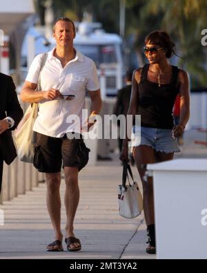 EXCLUSIVE!! Naomi Campbell and her Russian boyfriend Vladislav Doronin live the life of luxury cruising the water around Miami on a $10,950,000 Lazzara yacht. The couple passed the huge mansion they have reportedly purchased on Star Island for $16,000,000 as they went. The Supermodel lounged in a chair on the top of the double decker Angela D during the sunset ride home with her hunky beau but stood up to view their new home as they floated by. Miami, FL. 10/11/09. Stock Photo