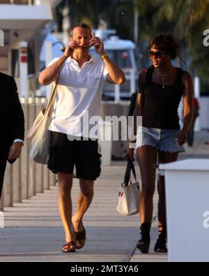 EXCLUSIVE!! Naomi Campbell and her Russian boyfriend Vladislav Doronin live the life of luxury cruising the water around Miami on a $10,950,000 Lazzara yacht. The couple passed the huge mansion they have reportedly purchased on Star Island for $16,000,000 as they went. The Supermodel lounged in a chair on the top of the double decker Angela D during the sunset ride home with her hunky beau but stood up to view their new home as they floated by. Miami, FL. 10/11/09. Stock Photo