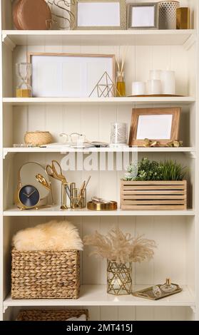 White shelving unit with different decorative elements Stock Photo