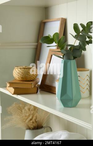 White shelving unit with different decorative elements Stock Photo