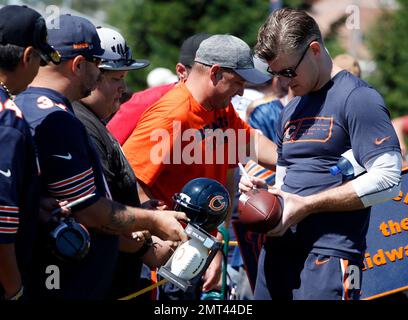 Chicago Bears general manager Ryan Poles talks on the phone as he watches  players during the NFL football team's rookie minicamp at Halas Hall in  Lake Forest, Ill., Saturday, May 6, 2023. (