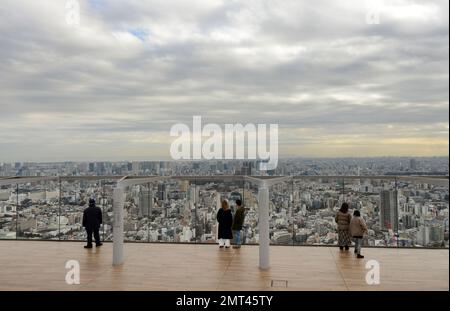 Tourist enjoying the views from the Shibuya Sky roof on top of the Scramble Square building in Shibuya, Tokyo, Japan. Stock Photo