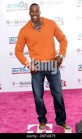 NBA player Dwight Howard of the Orlando Magic poses for photographers on the pink carpet ahead of the 2011 NBA All-Star game held at the Staples Center which saw West win 148-143 over the East. Los Angeles, CA. 02/20/11. Stock Photo
