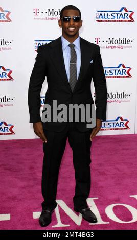 NBA player Chris Paul of the New Orleans Hornets poses for photographers on the pink carpet ahead of the 2011 NBA All-Star game held at the Staples Center which saw West win 148-143 over the East. Los Angeles, CA. 02/20/11. Stock Photo