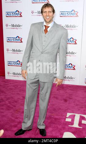 NBA player Dirk Nowitzki of the Dallas Mavericks poses for photographers on the pink carpet ahead of the 2011 NBA All-Star game held at the Staples Center which saw West win 148-143 over the East. Los Angeles, CA. 02/20/11. Stock Photo