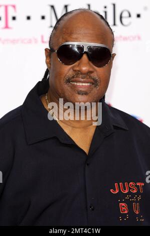 Musician Stevie Wonder poses for photographers on the pink carpet ahead of the 2011 NBA All-Star game held at the Staples Center. Los Angeles, CA. 02/20/11. Stock Photo
