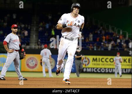 Cincinnati Reds' Derek Dietrich rounds second base after hitting a