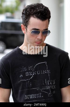 EXCLUSIVE!! Kevin Jonas out window shopping in Beverly Hills, CA. 5/8