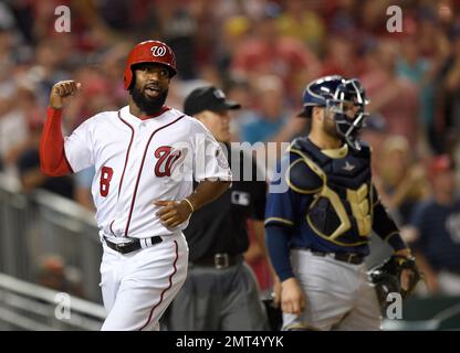 Washington Nationals Brian Goodwin (R) celebrates with Bryce Harper (L)  after hitting a solo home run against the Chicago Cubs in the ninth inning  at Wrigley Field on August 6, 2017 in