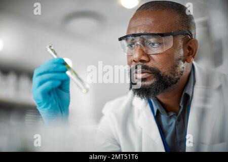 Plant scientist, thinking or test tubes in laboratory pharma, medical science research or gmo food engineering. Worker, man or biologist with glass Stock Photo