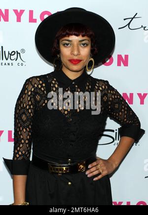 DJ Rashida poses for photographers on the red carpet at NYLON ...