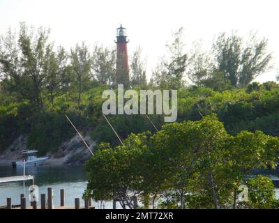 Exclusive!! This is the new Florida home of Olivia Newton-John and John Easterling. The 5,500 square feet abode has four bedrooms, four bathrooms and a dock. The 'blue water' home also has views of the Jupiter Lighthouse and over an acre of property. The couple purchased the home that was listed by realtor Tom DiSarno of Golden Bear Realty for $4.1m. Over the years, the small community of Jupiter Inlet has had other famous residents including crooner Perry Como. Miami, FL. 6/22/09. Stock Photo