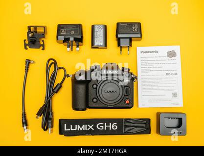 Paris, France - Nov 20, 2022: Unboxing flat lay overhead lateral view of Panasonic Lumix DMC-GH6 Micro Four Thirds System digital still video camera with 5k 10 bit Video recording internal capability Stock Photo