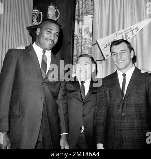 Weeb Ewbank, center, coach of the New York Jets, shows quarterback