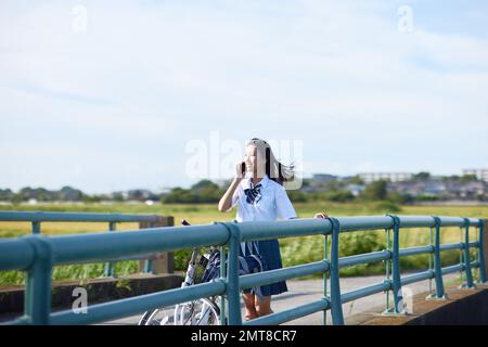 Japanese high school student portrait outdoors Stock Photo