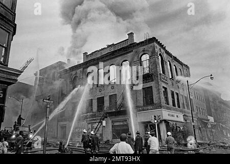 https://l450v.alamy.com/450v/2mt93hx/file-in-this-july-15-1967-file-photo-firefighters-direct-streams-of-water-onto-a-burning-building-at-the-corner-of-prince-and-court-streets-in-newark-nj-where-four-days-of-deadly-violence-and-looting-came-to-be-known-as-the-newark-riotsap-photomarty-lederhandler-file-2mt93hx.jpg