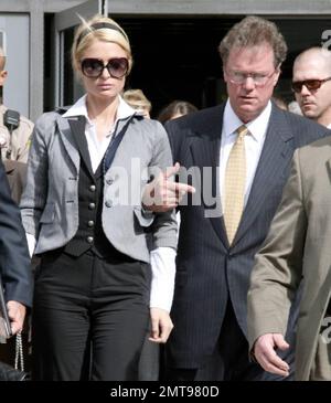 Paris Hilton broke down in tears today as she left a downtown Los Angeles, Ca. courtroom where she was  sentenced to 45 days in jail for driving with a suspended license. Hilton told the judge: 'I'm very sorry and from now on I'm going to pay complete attention to everything...I did not do it on purpose at all.' Paris needed to be physically supported by her father as she exited the building and held her head high as tears streamed down her face but it wasn't until she was inside her car that Paris broke down sobbing. Also attending the probation revocation hearing was Paris' mother Kathy. 5/4 Stock Photo