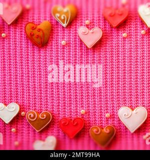 Pink Folded Fabric Texture. Handmade cookies on a table. Valentine conception Stock Photo