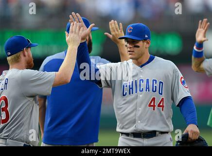 Chicago Cubs' Anthony Rizzo (L) celebrates with Kris Bryant (17) and Javier  Baez (9) celebrates with Addison Russell (R) after defeating the Los  Angeles Dodgers 5-0 in game 6 to win the