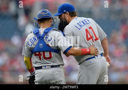 Chicago Cubs John Lackey (L) talks with Willson Contreras (C) and Anthony  Rizzo (R) in the fifth inning of a game against the St. Louis Cardinals at  Wrigley Field on September 15