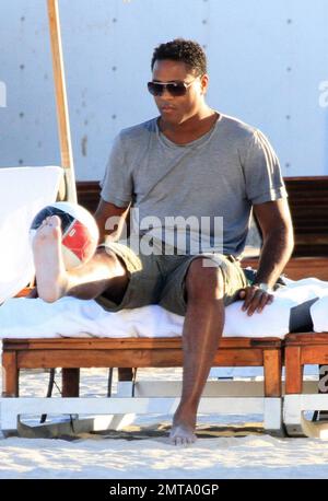 Patrick Kluivert, former Dutch footballer and current NEC Nijmegen Assistant Coach, enjoys a day on the beach playing soccer with his wife, Rossana Lima and his son, Shane Patrick, during a winter holiday in Miami Beach, FL. 1/5/11.    . Stock Photo