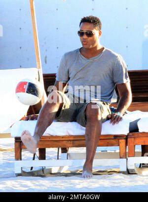 Patrick Kluivert, former Dutch footballer and current NEC Nijmegen Assistant Coach, enjoys a day on the beach playing soccer with his wife, Rossana Lima and his son, Shane Patrick, during a winter holiday in Miami Beach, FL. 1/5/11.    . Stock Photo