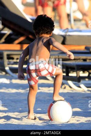 Patrick Kluivert, former Dutch footballer and current NEC Nijmegen Assistant Coach, enjoys a day on the beach playing soccer with his wife, Rossana Lima and his son, Shane Patrick, during a winter holiday in Miami Beach, FL. 1/5/11.    . Stock Photo