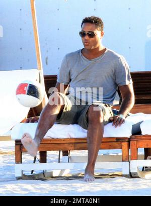 Patrick Kluivert, former Dutch footballer and current NEC Nijmegen Assistant Coach, enjoys a day on the beach playing soccer with his wife, Rossana Lima and his son, Shane Patrick, during a winter holiday in Miami Beach, FL. 1/5/11. Stock Photo