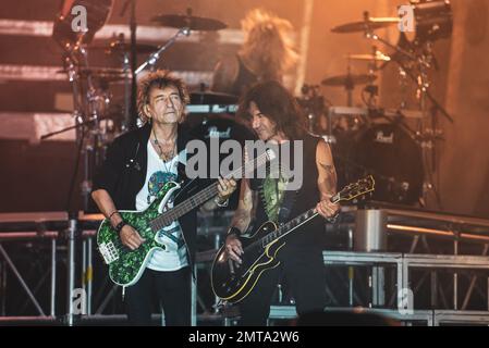 STADIO OLIMPICO, TURIN, ITALY: Claudio Golinelli (L) and Stef Burns (R), bassist and guitarist of the Italian rocker rocker Vasco Rossi, performing live on stage for his “LIVE KOM” tour Stock Photo
