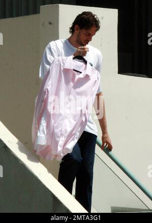 A day after winning the NBA Championship, Lakers center Pau Gasol dresses down and leaves his home to run some errands, carrying along some dress shirts. Redondo Beach, CA. 6/18/10. Stock Photo