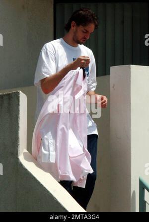 A day after winning the NBA Championship, Lakers center Pau Gasol dresses down and leaves his home to run some errands, carrying along some dress shirts. Redondo Beach, CA. 6/18/10. Stock Photo