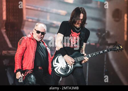 STADIO OLIMPICO, TURIN, ITALY: Vince Pastano (R), guitarist of the Italian rocker Vasco Rossi (L), performing live on stage for the “LIVE KOM” tour Stock Photo