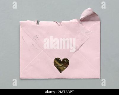 Torn (opened) envelope on a grey background Stock Photo