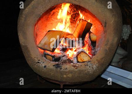 Close-up of a blazing chiminea - John Gollop Stock Photo