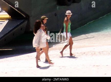 EXCLUSIVE!! Penelope Cruz is seen barefoot on a deserted island beach
