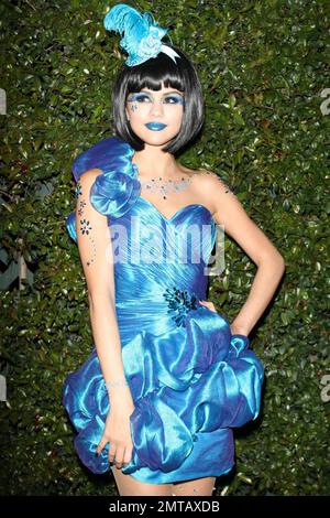 Selena Gomez dressed in a shimmering blue dress with blue sparkle