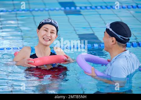 Japanese senior couple at indoor swimming pool Stock Photo - Alamy