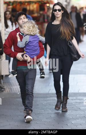 'Fallout Boy' rocker Pete Wentz takes his son Bronx and model girlfriend Meagan Camper to see a movie at Universal City Walk. Pete, in a green t-shirt, red sweatshirt, black pants and grey sneakers, was seen carrying 2 year old Bronx while Meagan dressed in all black from head to toe followed close behind. Los Angeles, CA. 10th December 2011. Stock Photo