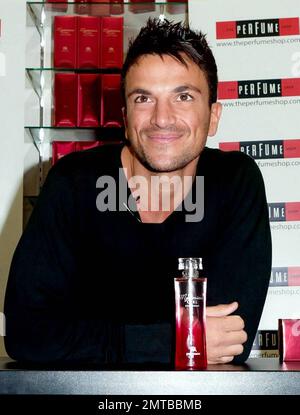 After a quick shirt change and half hour drive, singer and reality TV star Peter Andre appears at The Perfume Shop in Elms Shopping Centre in High Wycombe for an autograph session, launching his new fragrance for women, Mysterious Girl.  Earlier in the day Peter attended a photo call at The Chimes Shopping Centre in Uxbridge.  And while Peter has been busy maintaining his musical and merchandise career, ex-wife Katie Price appears to have been nurturing her new husband Alex Reid's professional mixed martial arts fighting career; she was seen ringside cheering Alex on last week during his UFC B Stock Photo